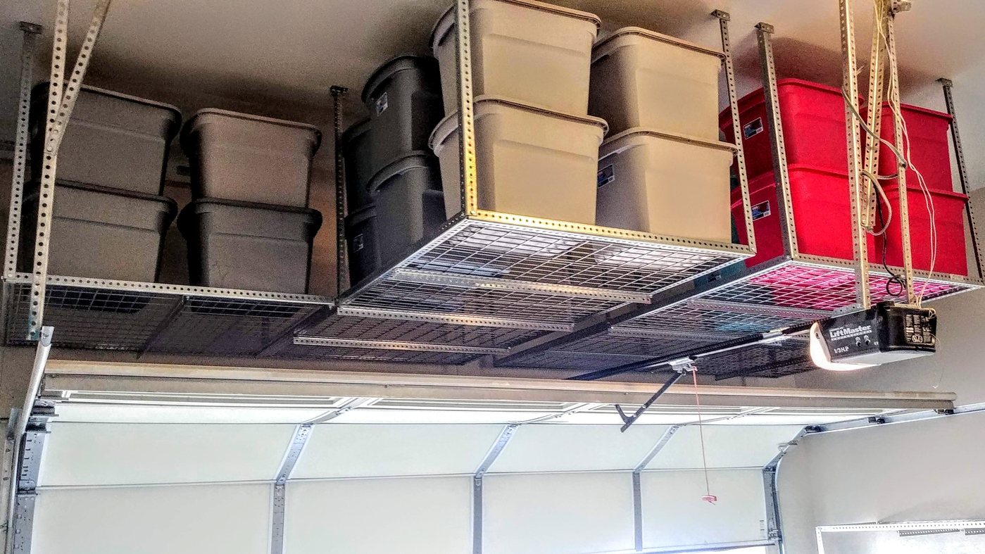 Two ceiling racks with bike and ladder hangers