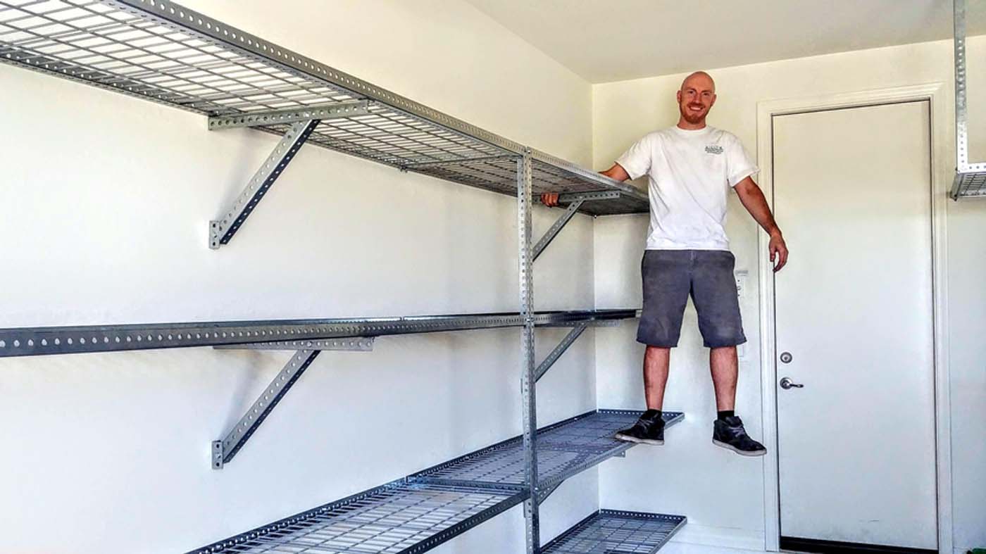 Four 2ft by 8ft heavy duty steel shelves
